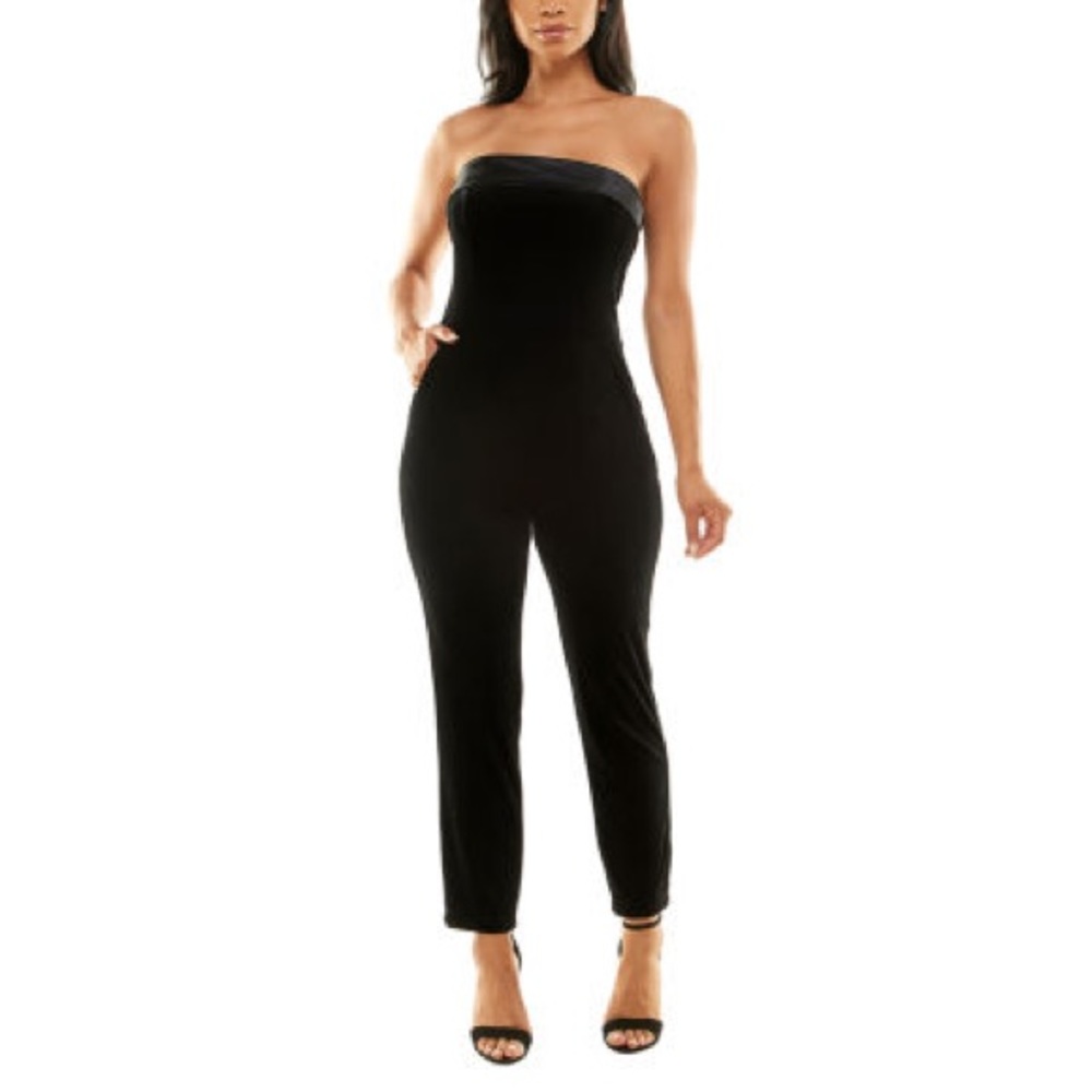 I am selling a never worn velvet jumpsuit. With Black silk around the shoulders.